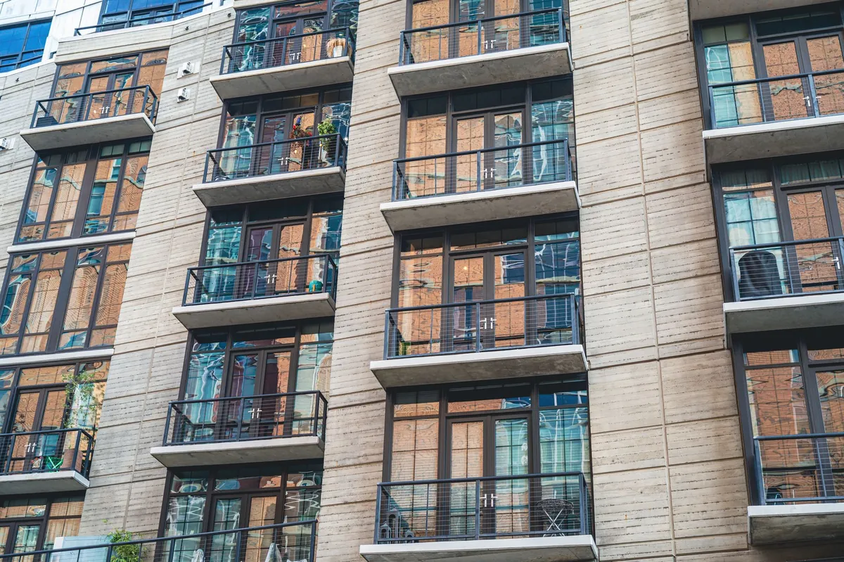 The balconies of a contemporary apartment building seen from the street