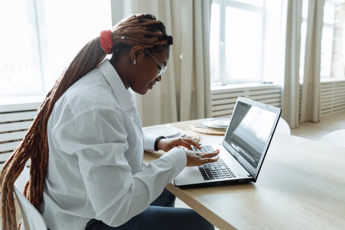 Hands on a keyboard, composing a reply