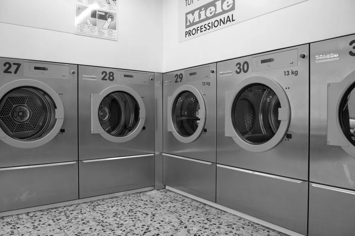 Modern front-load washing machine with laundry inside