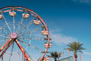Ferris wheel and palm trees at a festival grounds in Indio, California