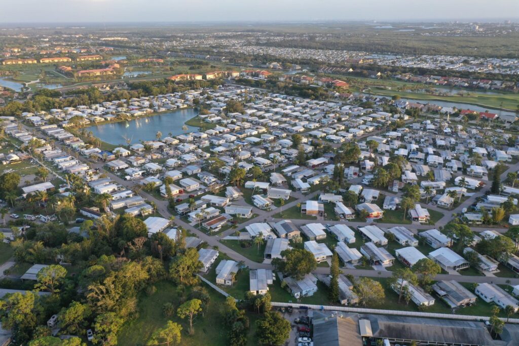 Aerial view of a residential community with houses and lakes in Florida