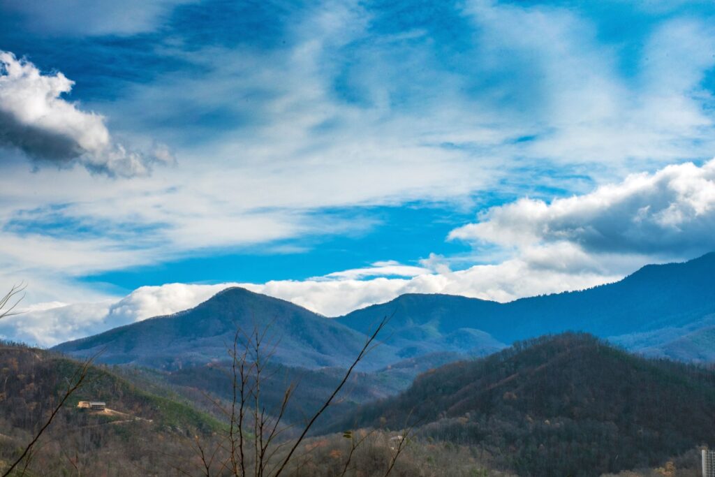 Mountain landscape with forested ridges under a clear blue sky