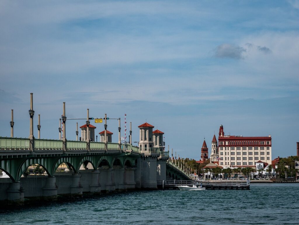 Bridge of Lions spanning the water with historic buildings in St. Augustine, Florida